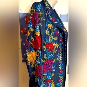 Anu Sz S.   Heavily and intricately embroidered mid-thigh embroidered jacket.
